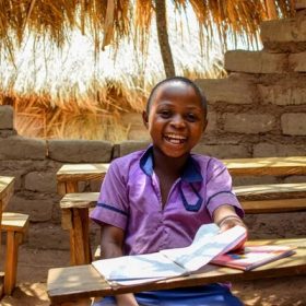 depositphotos_663330326-stock-photo-portrait-african-child-learning-rural